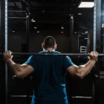 Man lifting heavy weights at gym