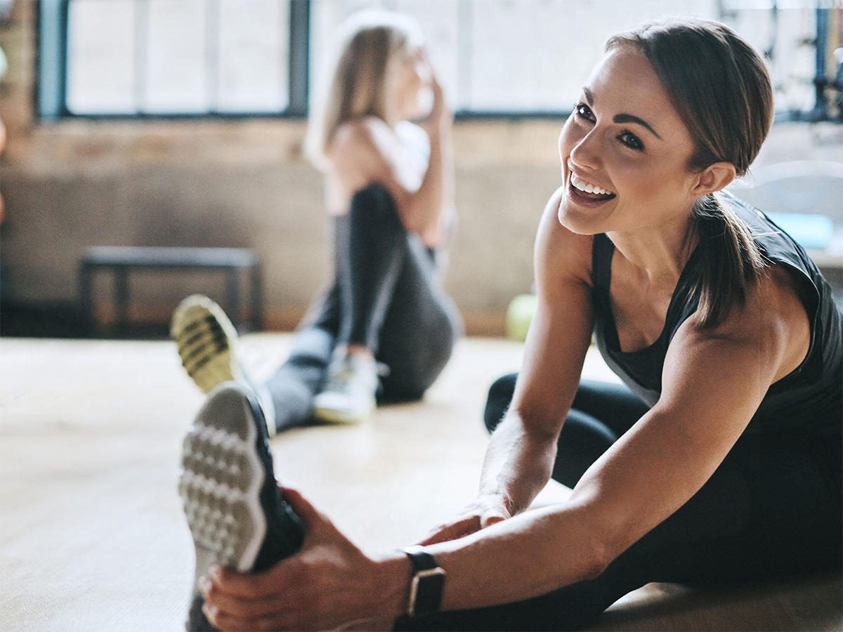 Group fitness class at Vickery's Sweat Shop, showcasing diverse participants and a qualified instructor in an energetic workout session