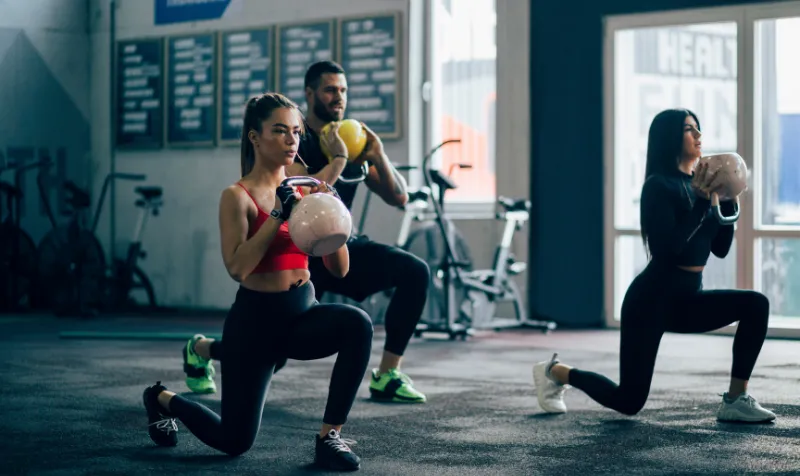 athletes working out in a 24 hour gym